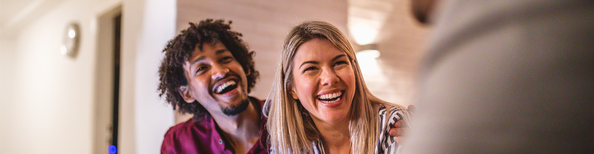 A man and woman laughing.