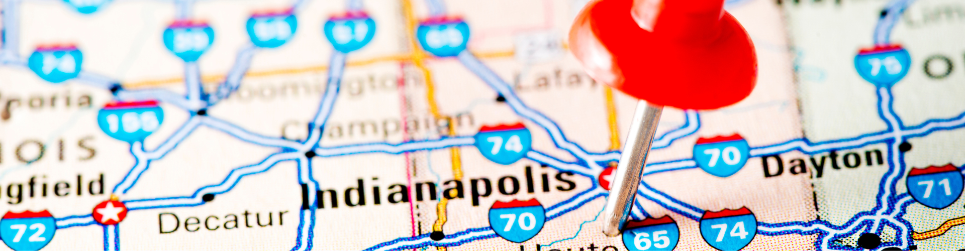 A red balloon on a map.