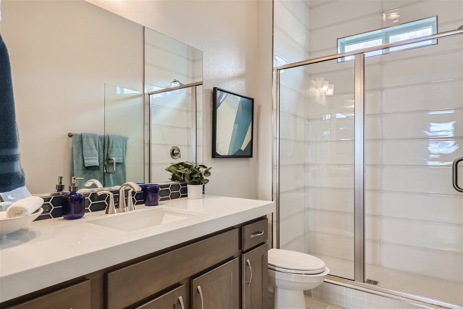 A bathroom with a glass shower.
