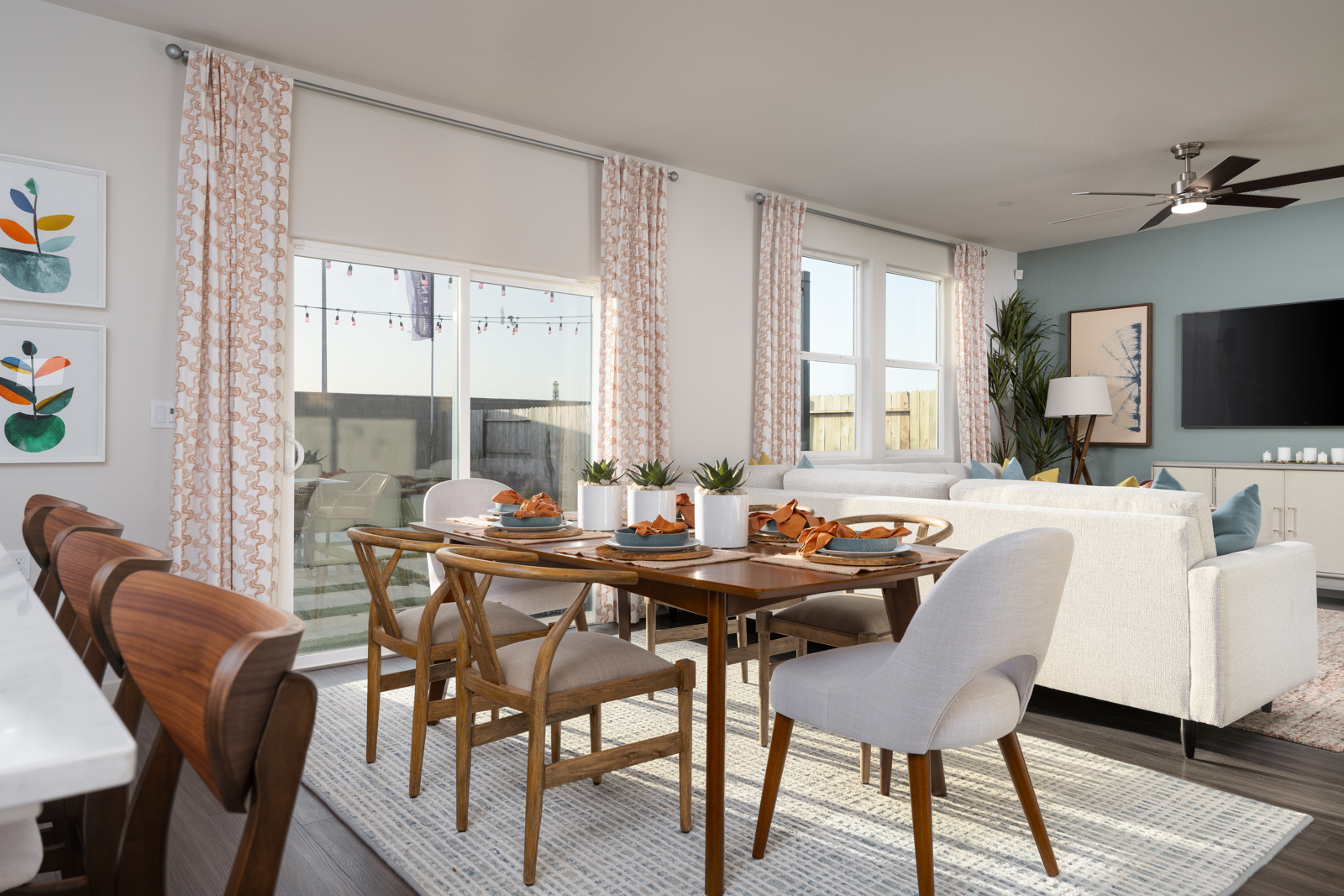 A dining room with a large table.