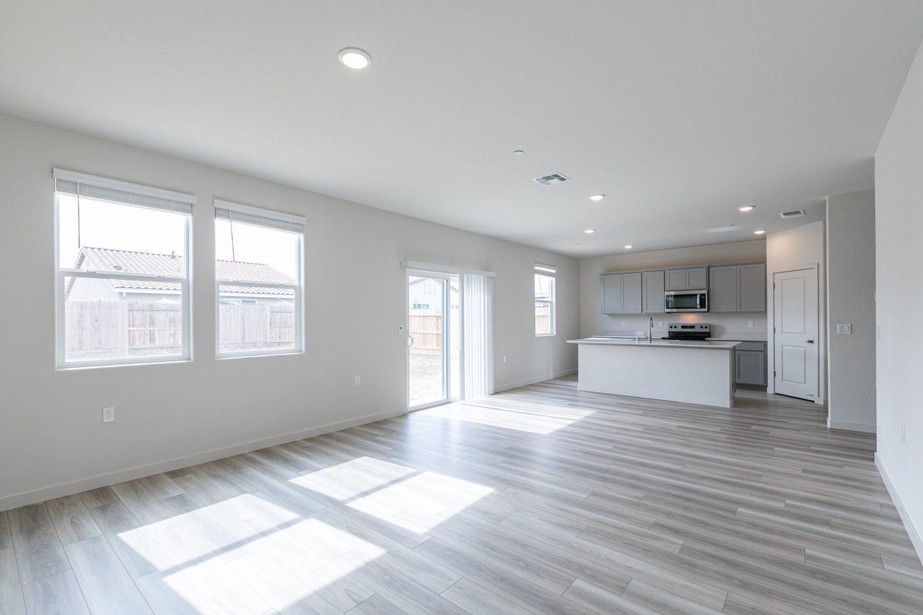 A large empty room with white walls.