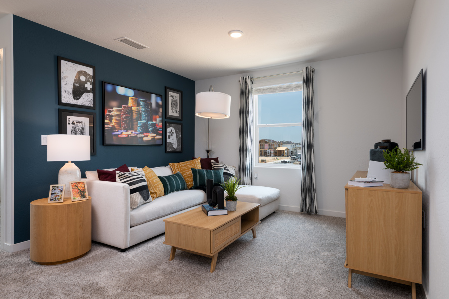 A living room with a couch and a table.