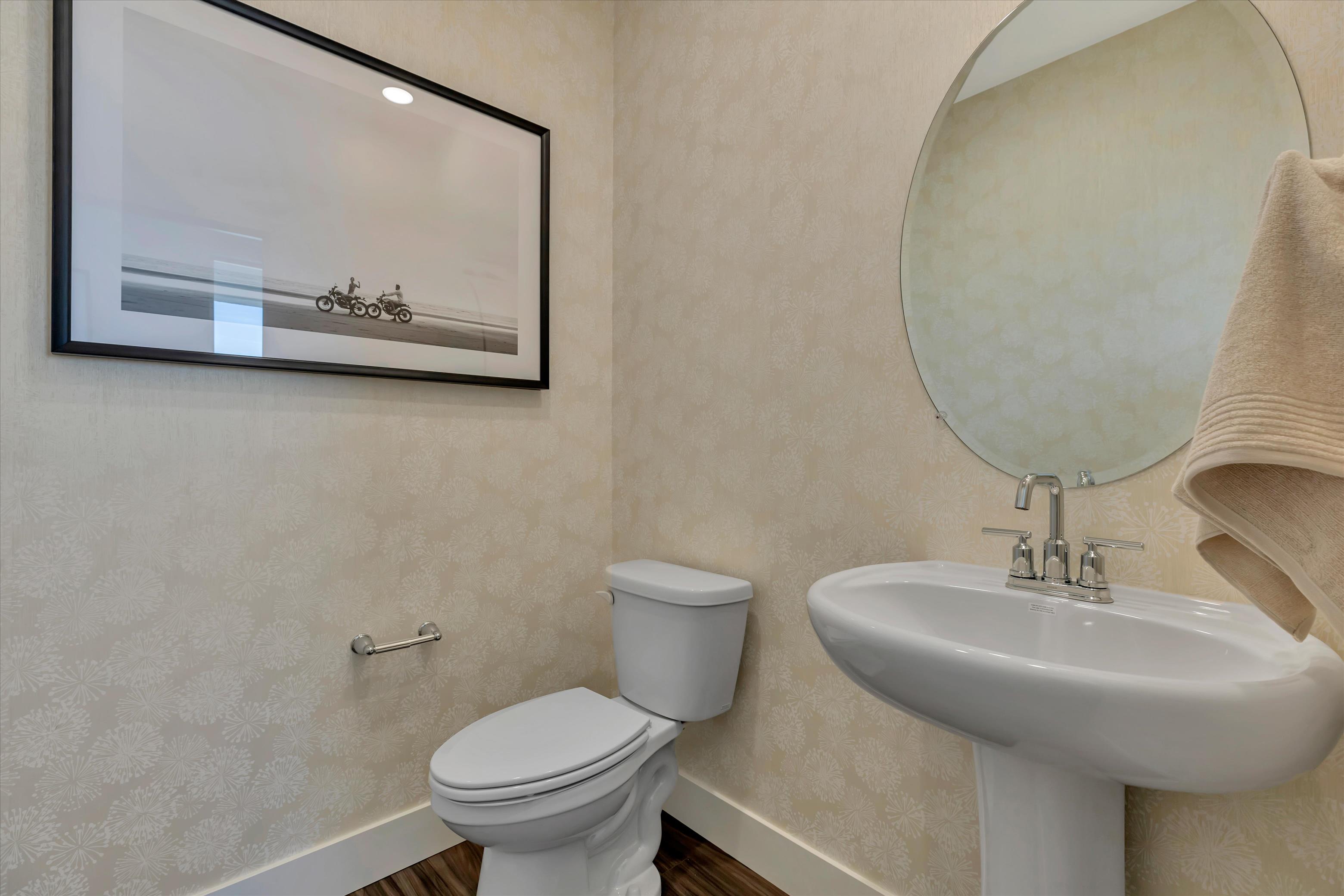 A bathroom with a toilet and a sink.
