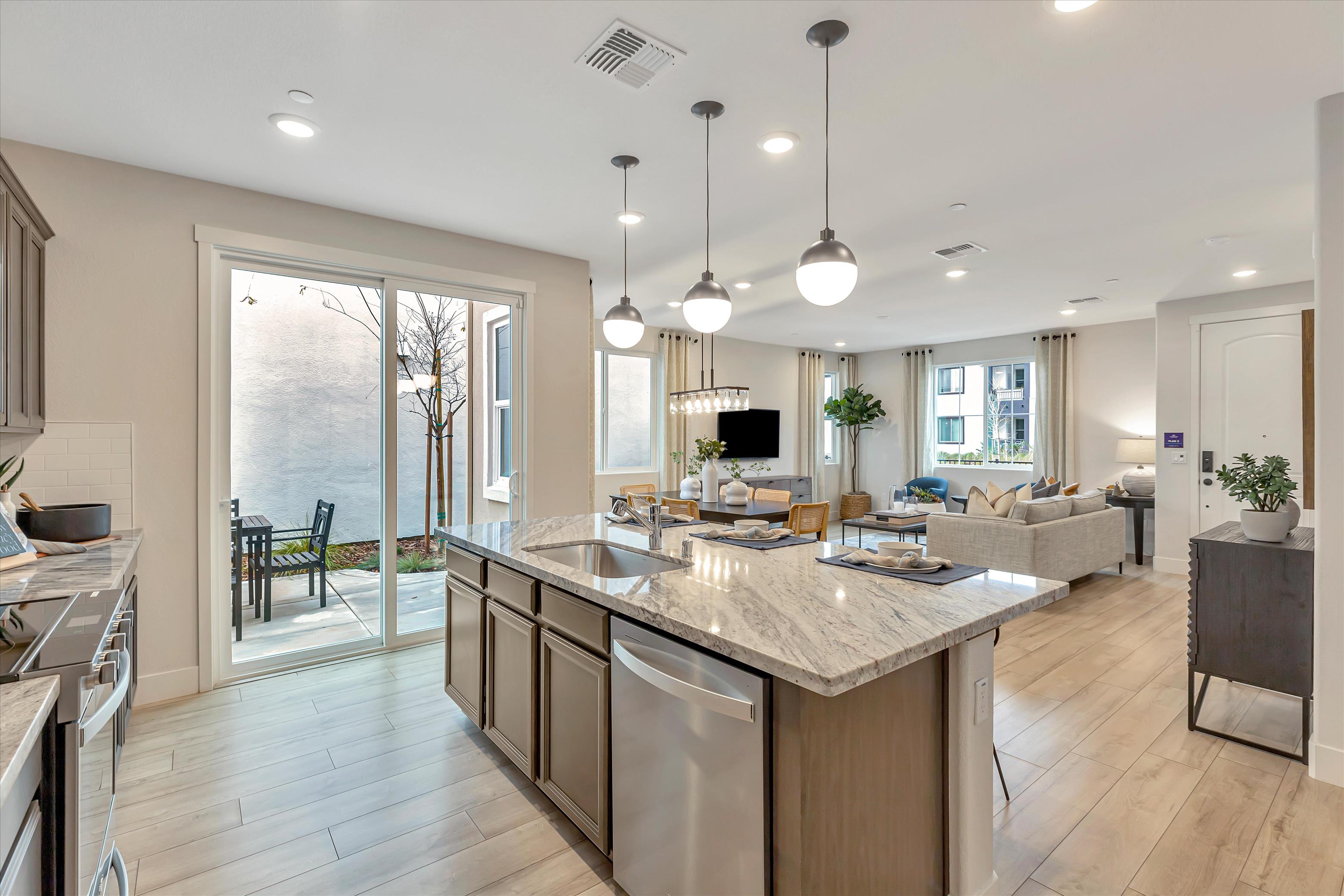 A kitchen with a marble island.