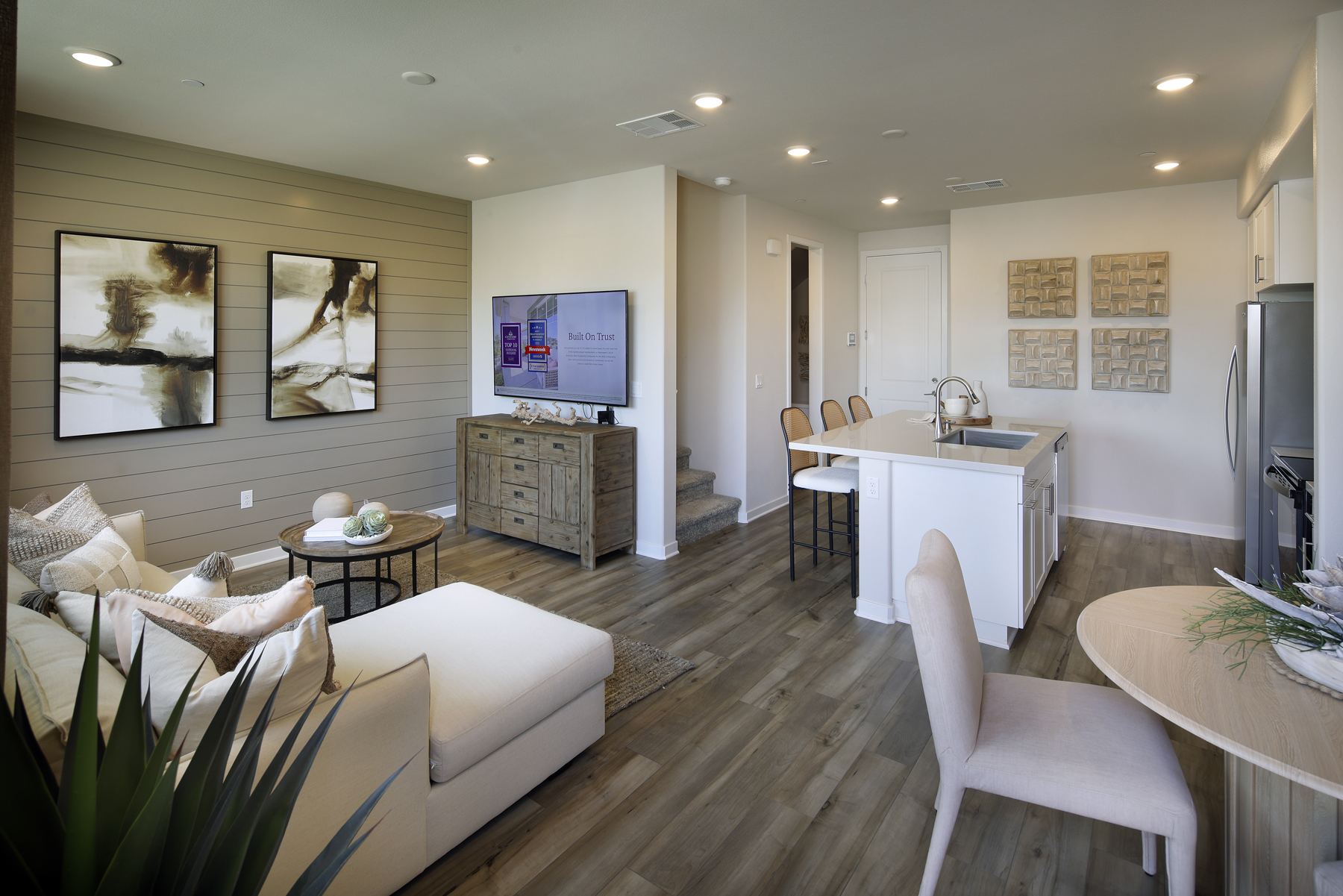 A living room with a tv and couches.