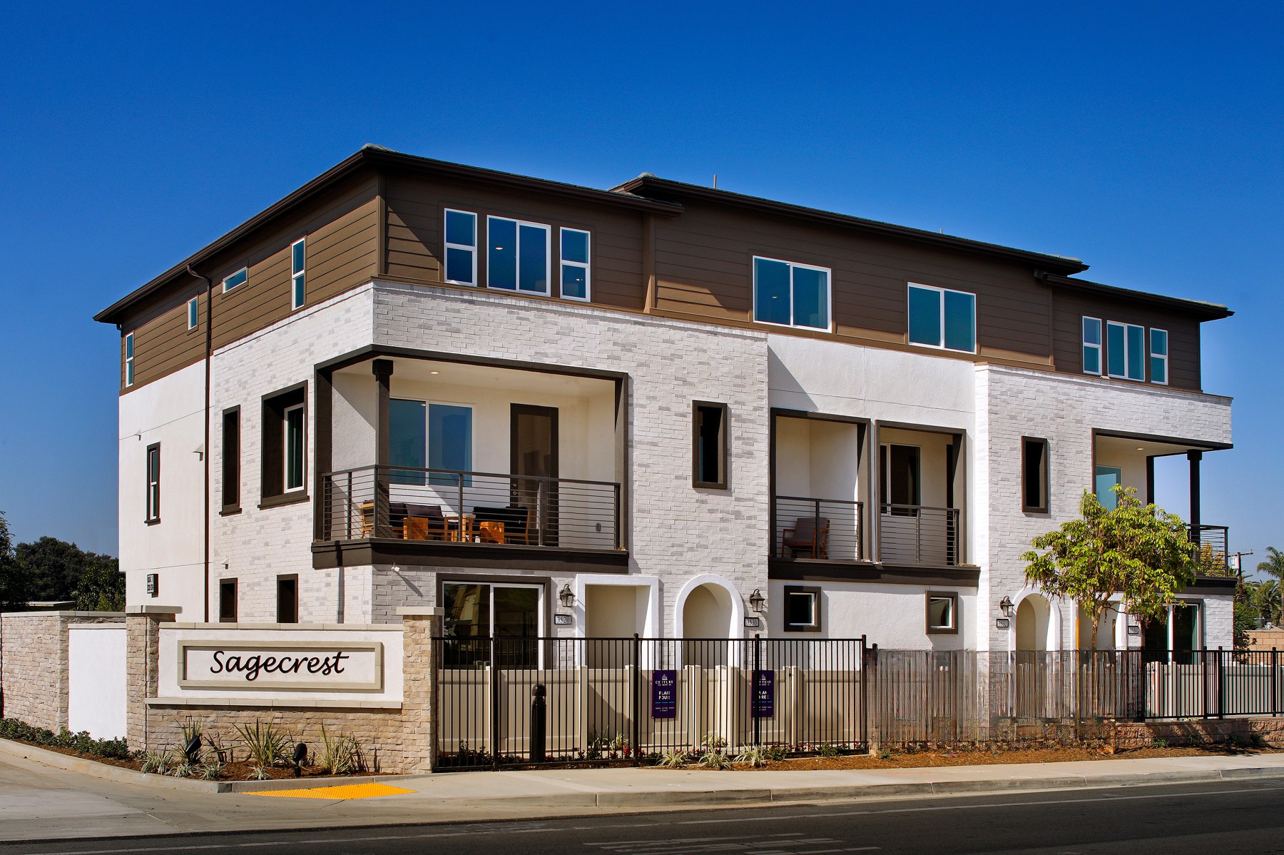 A large building with a fence in front of it.