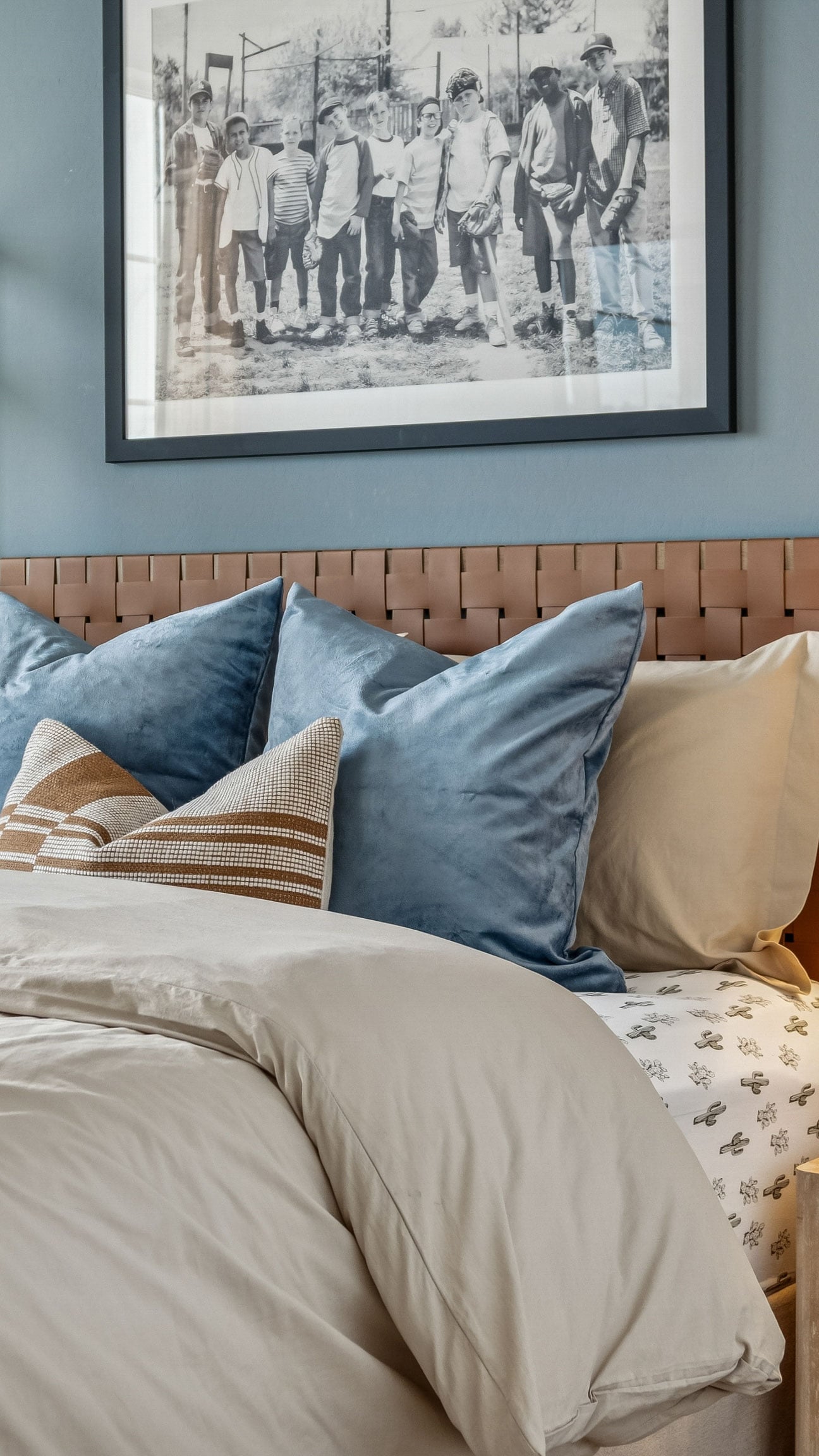 fluffy primary bed with contrast wall and deep teal color palette traditional home design model home - New construction homes for sale Goodyear AZ Resort style amenities & founder incentives to the lucky few first homeowners.