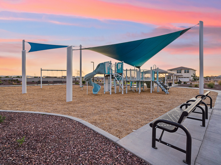 Montana Vista Community Photo of park, benches, trails, outdoor grills, cornhole lawn, and ramada with picnic tables. New Homes for Sale in South Buckeye AZ by Century Communities.