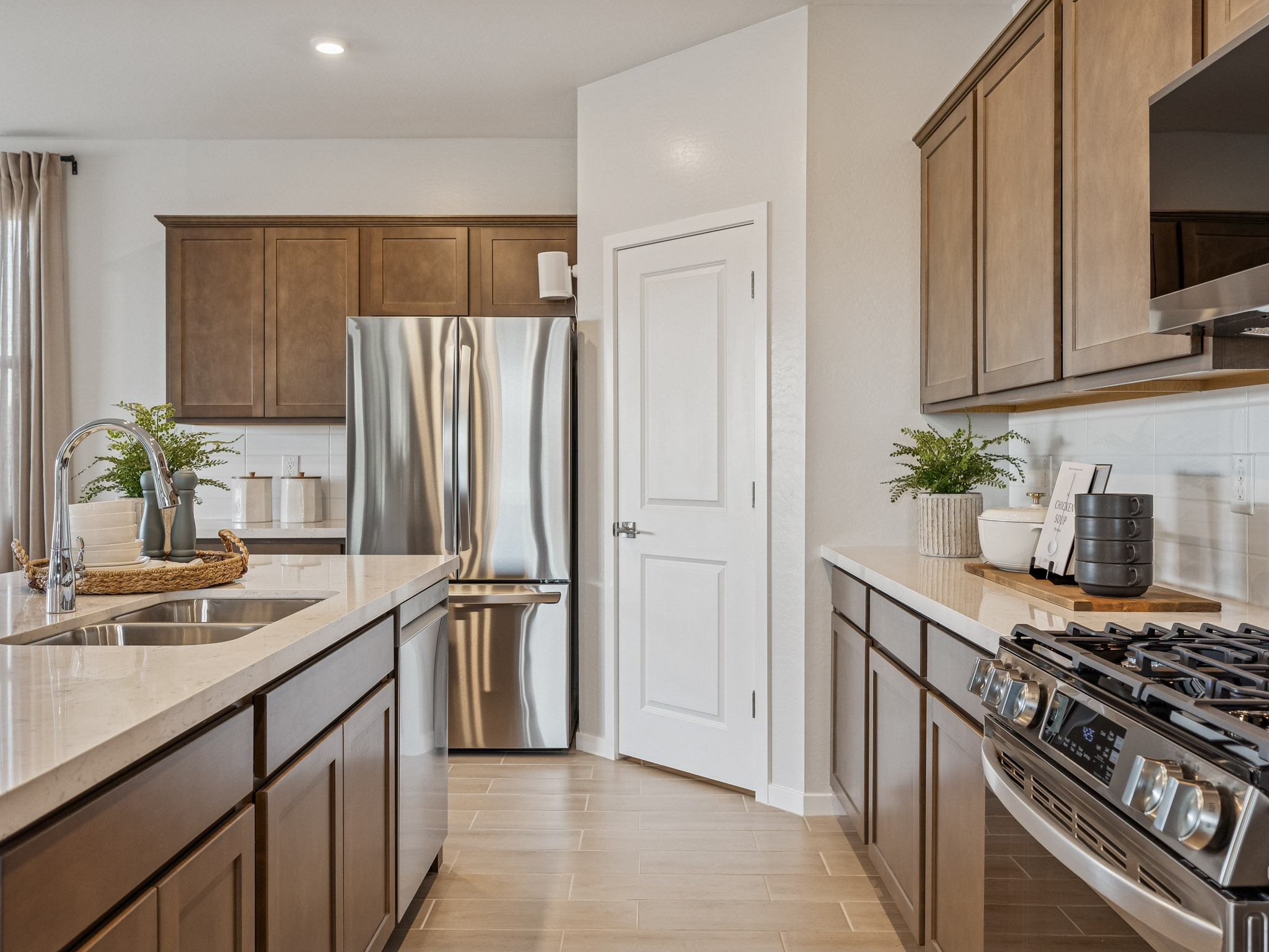 A kitchen with wooden cabinets.