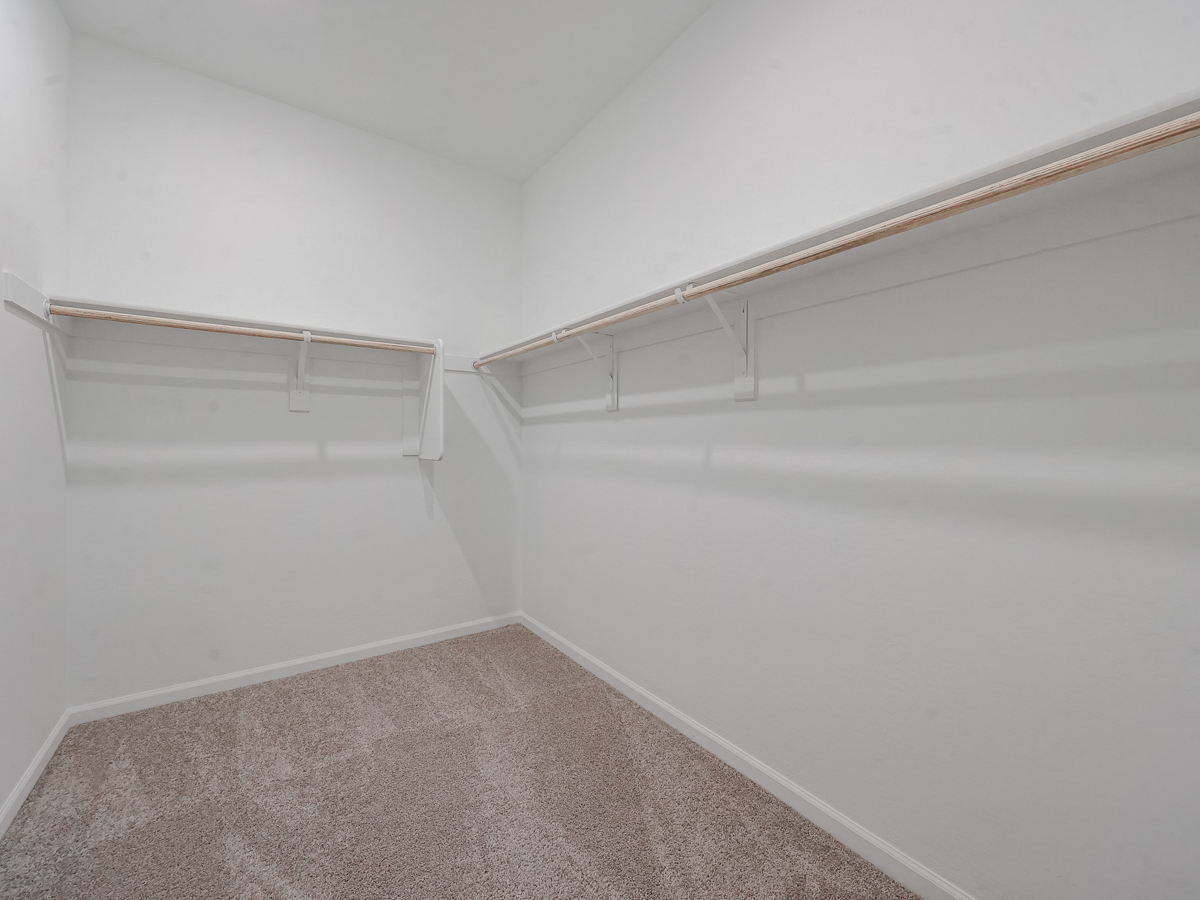 A white wall with a staircase.