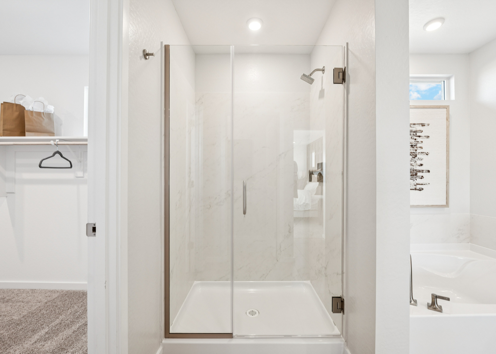 A bathroom with a glass shower.