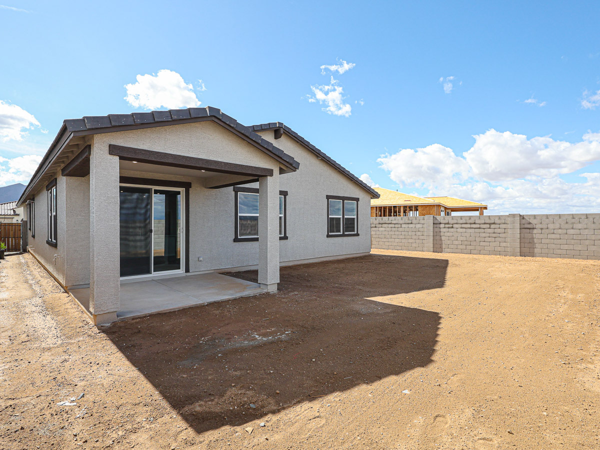 A house with a dirt yard.