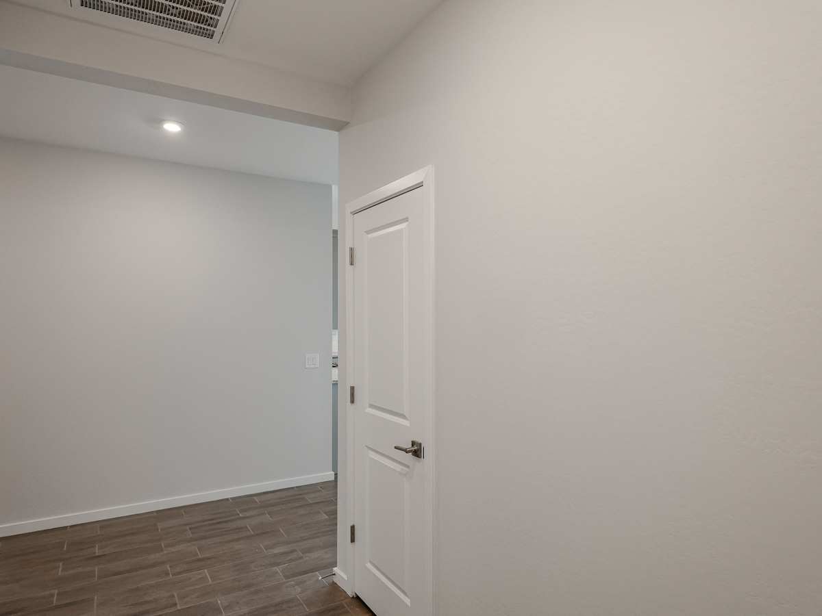 A white door in a room.