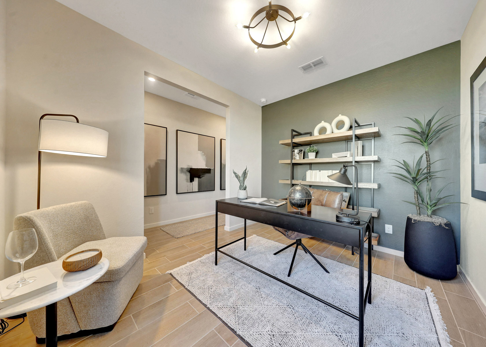 A living room with a table and chairs.