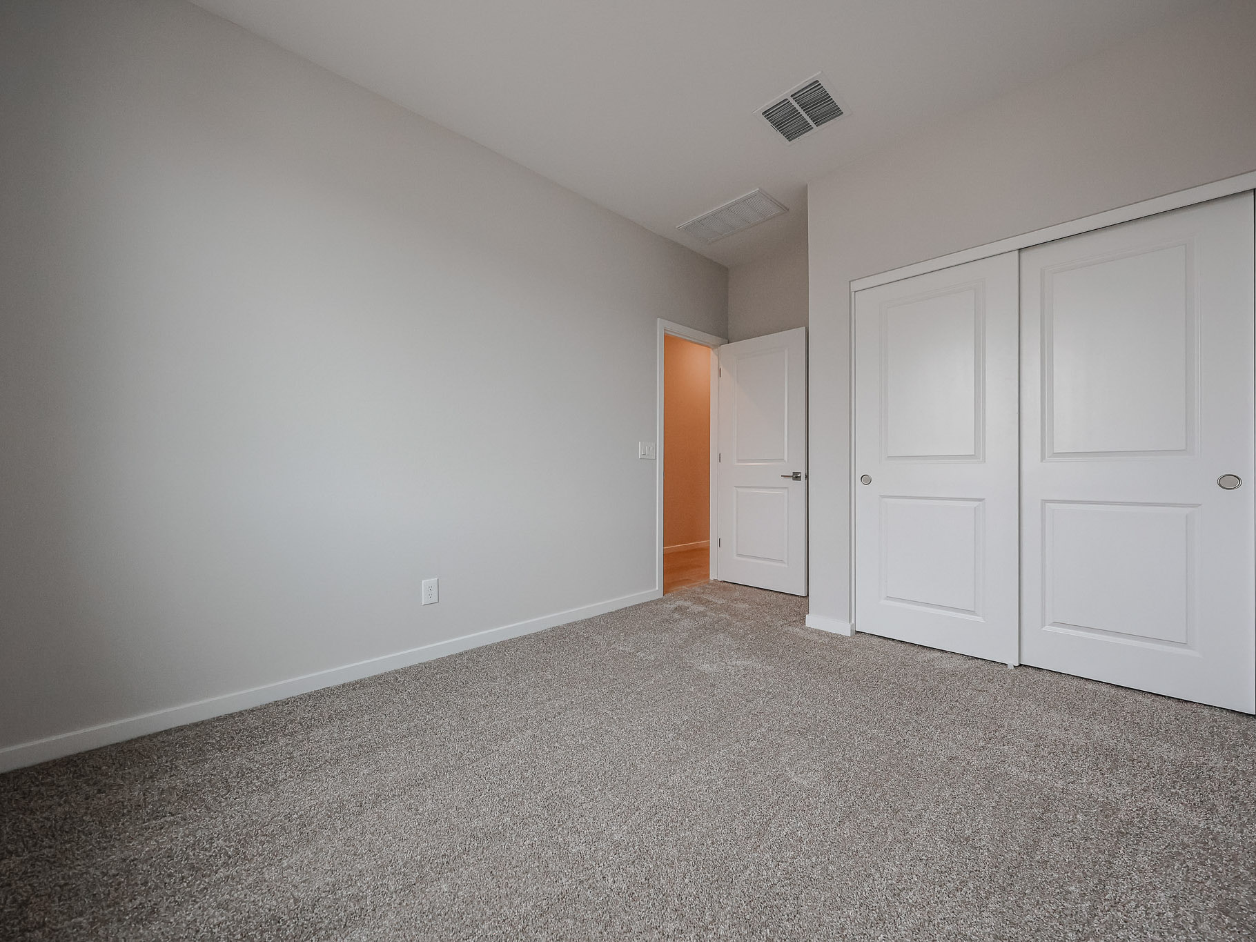 A room with white doors.