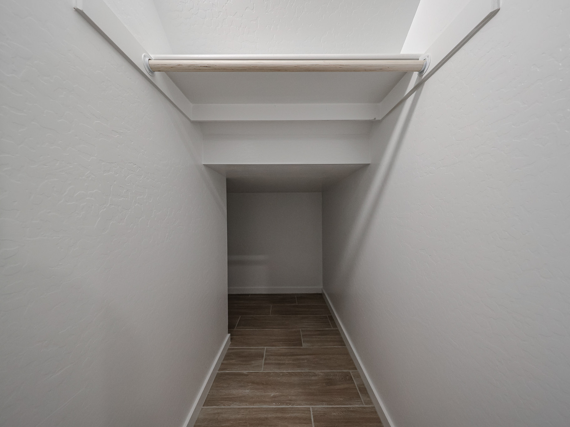 A hallway with white walls.