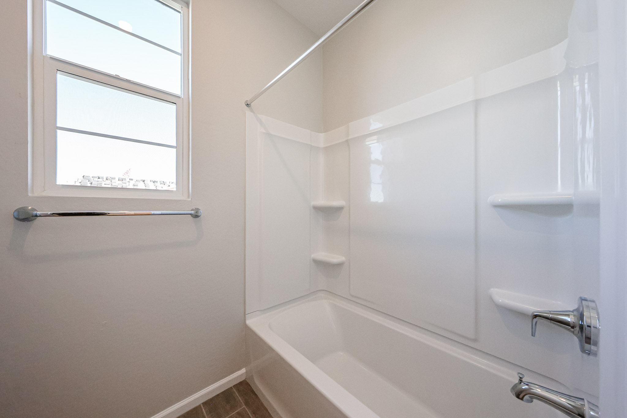 A bathtub with a window.