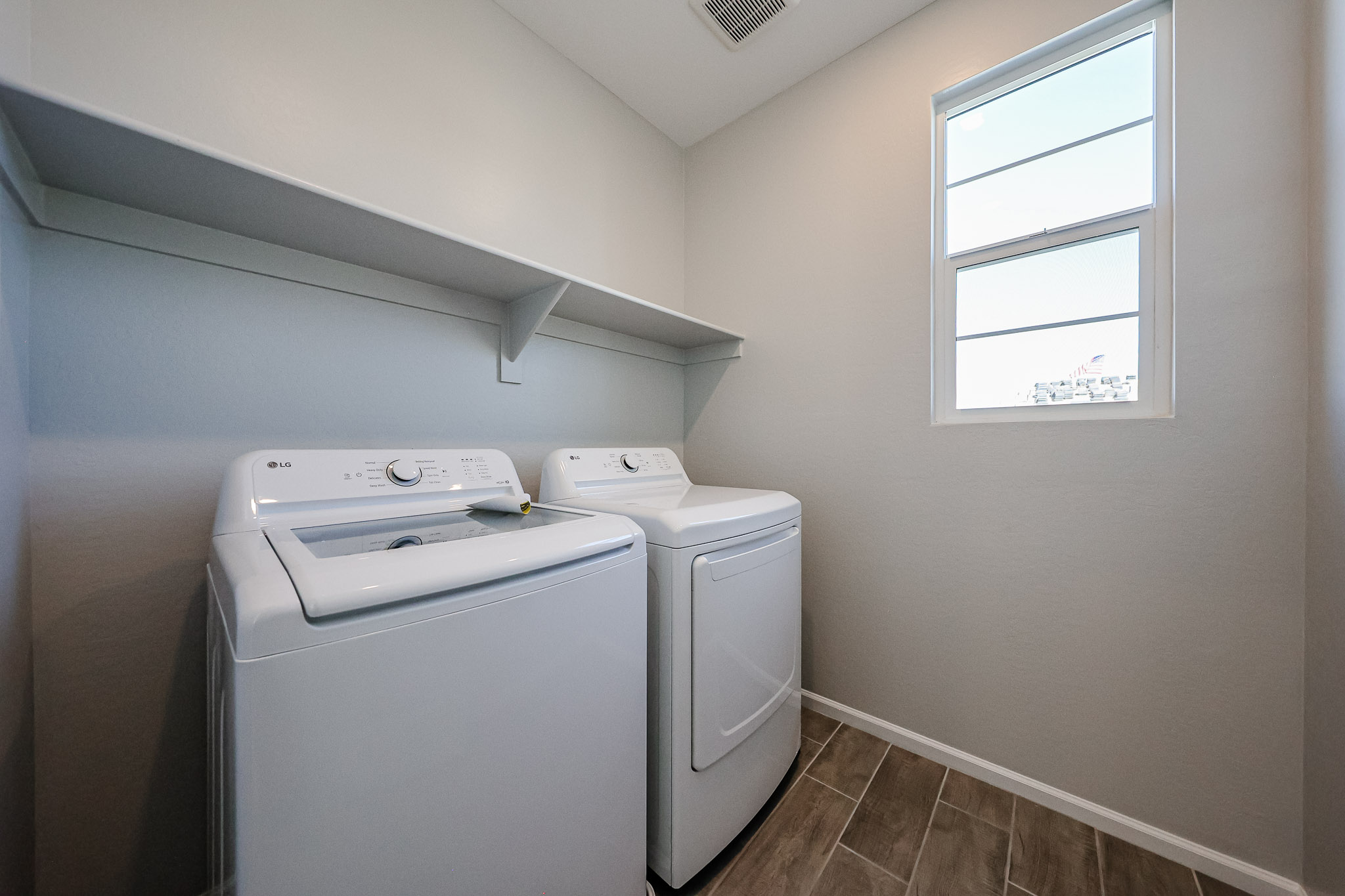 A washing machine in a room.