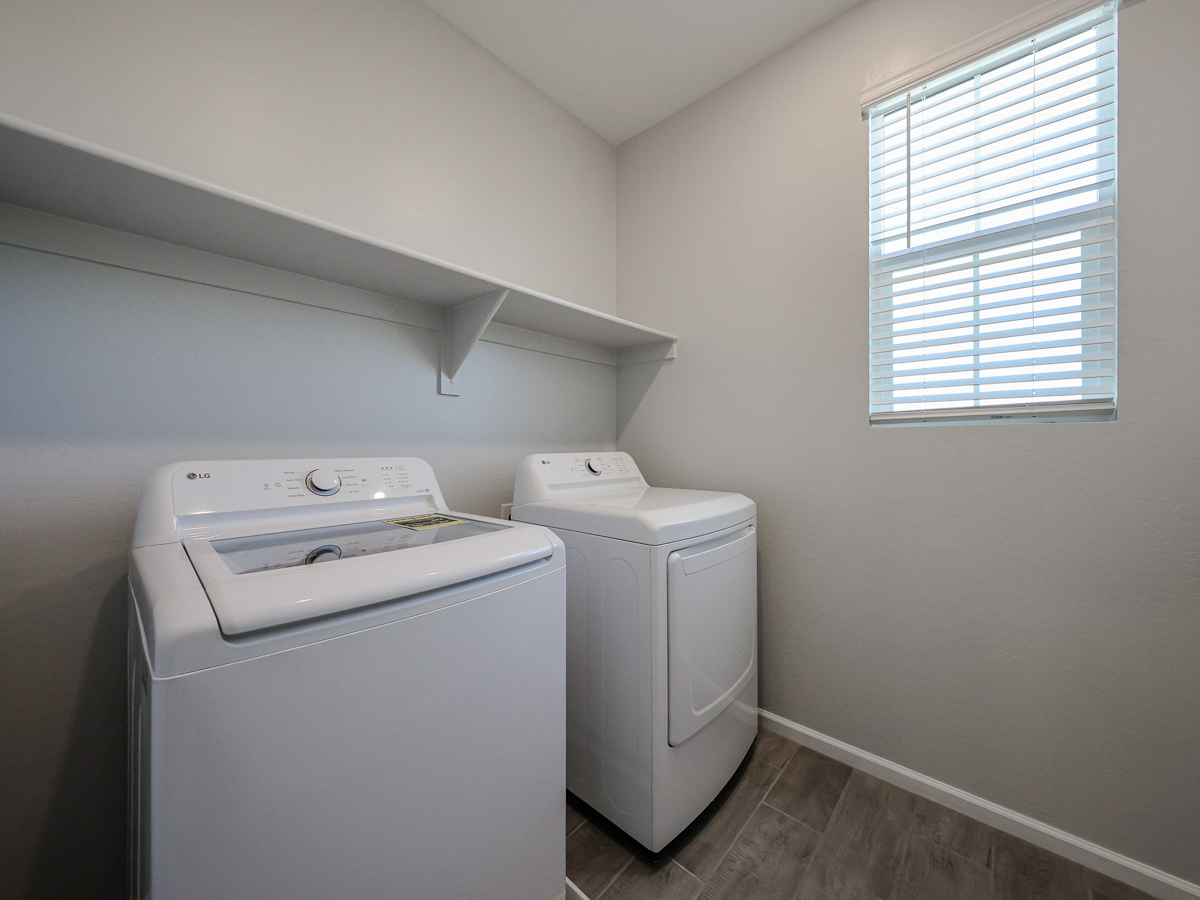 A washing machine in a room.