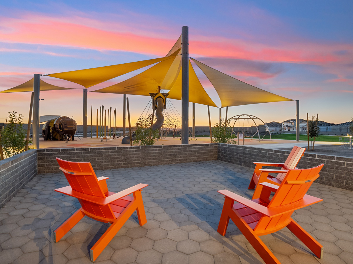 A patio with chairs and an umbrella.