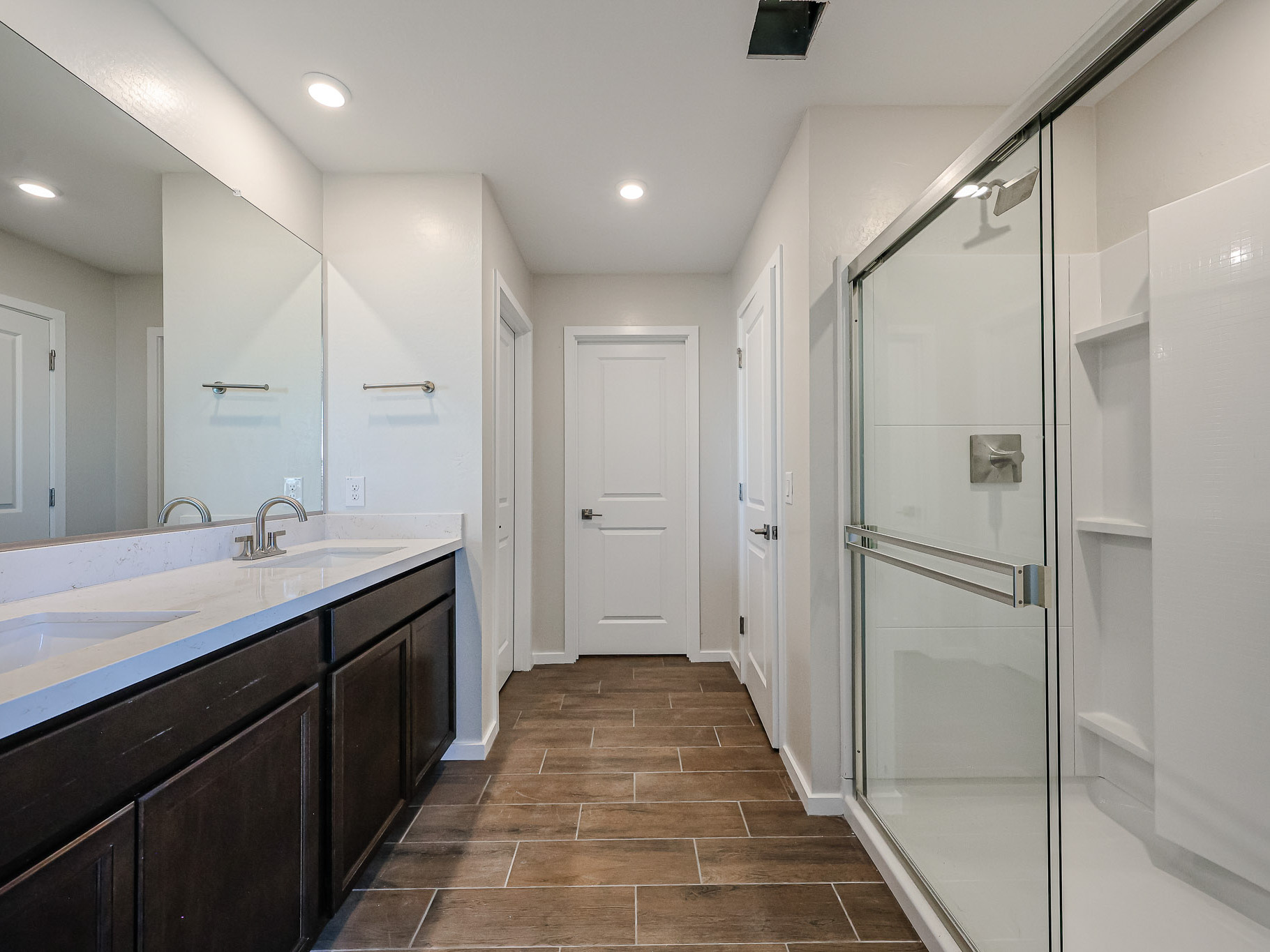 A bathroom with a glass shower.