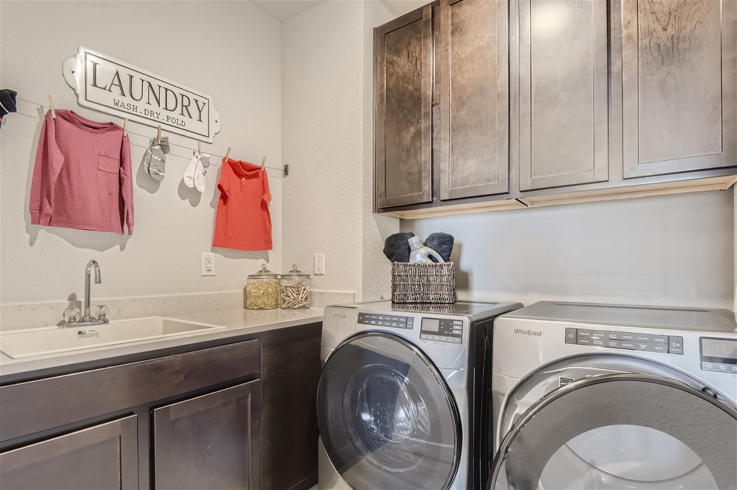 A laundry room with a washer and dryer.