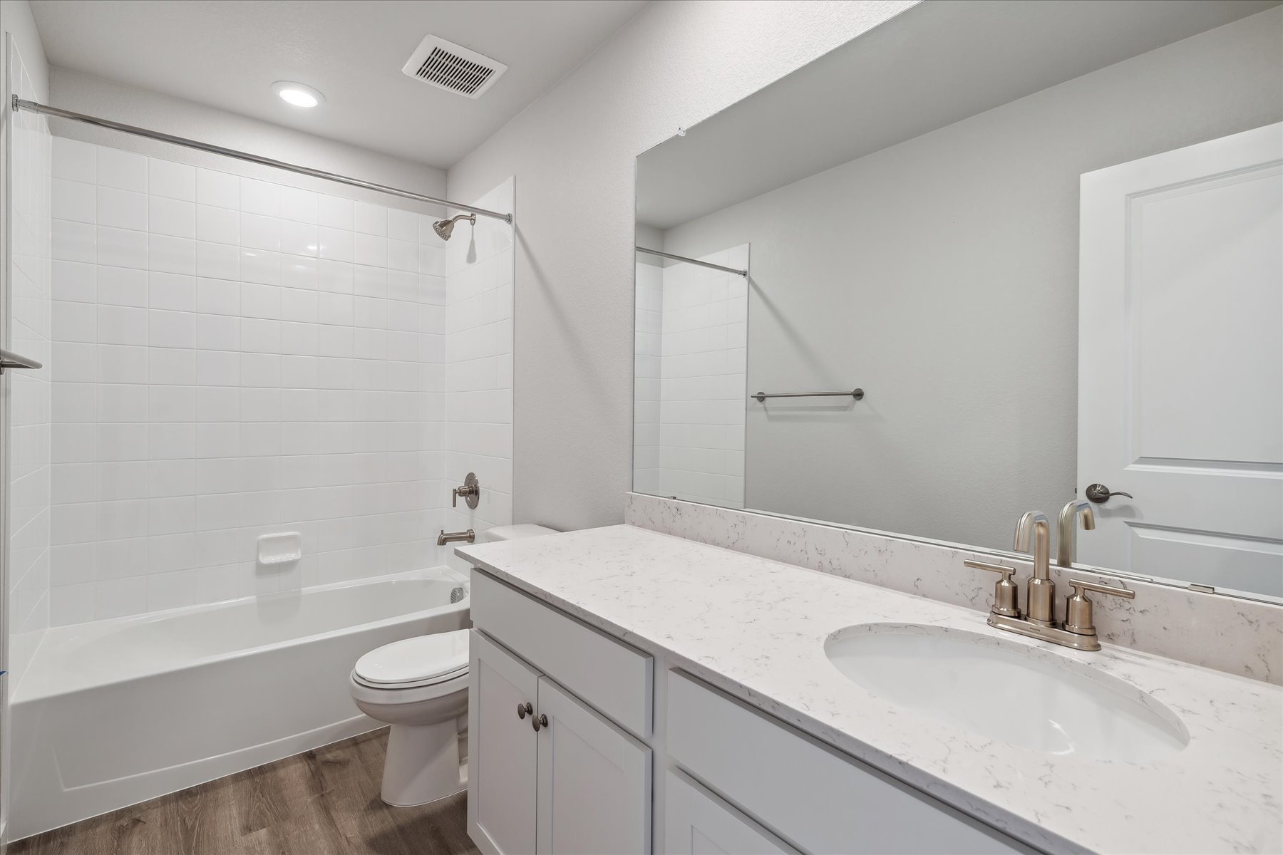 A bathroom with a sink and a toilet.