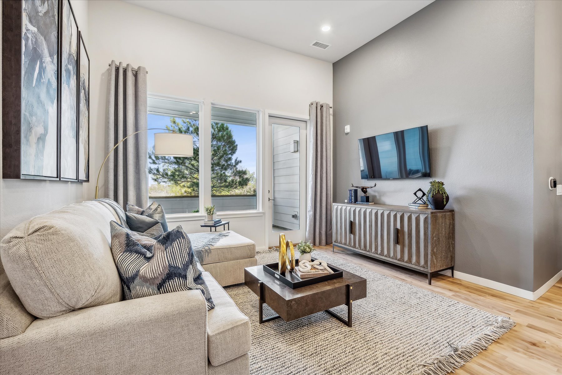 A living room with a large window.