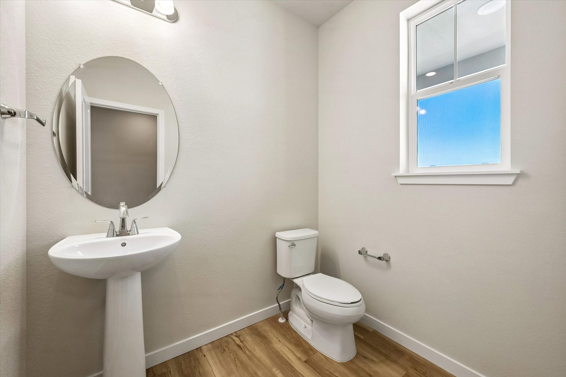 A bathroom with a toilet and sink.