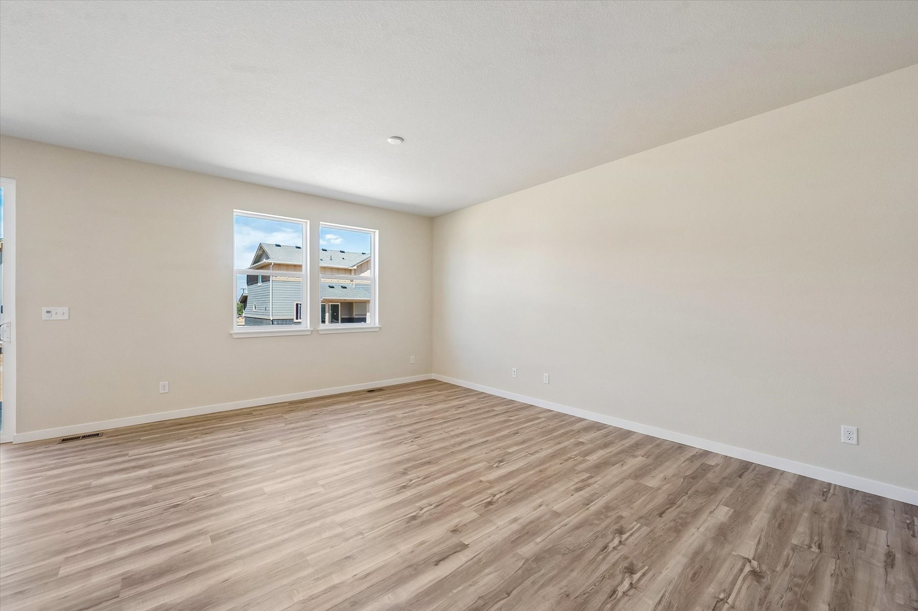 A room with a wood floor and a wood floor.