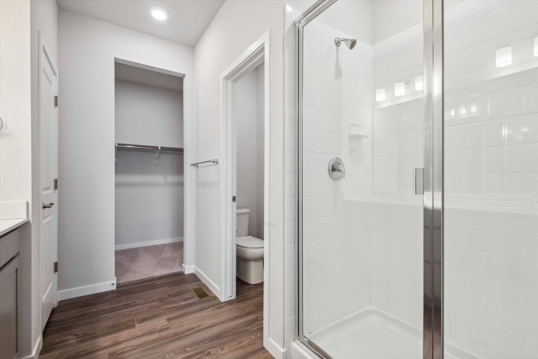 A bathroom with a glass shower.