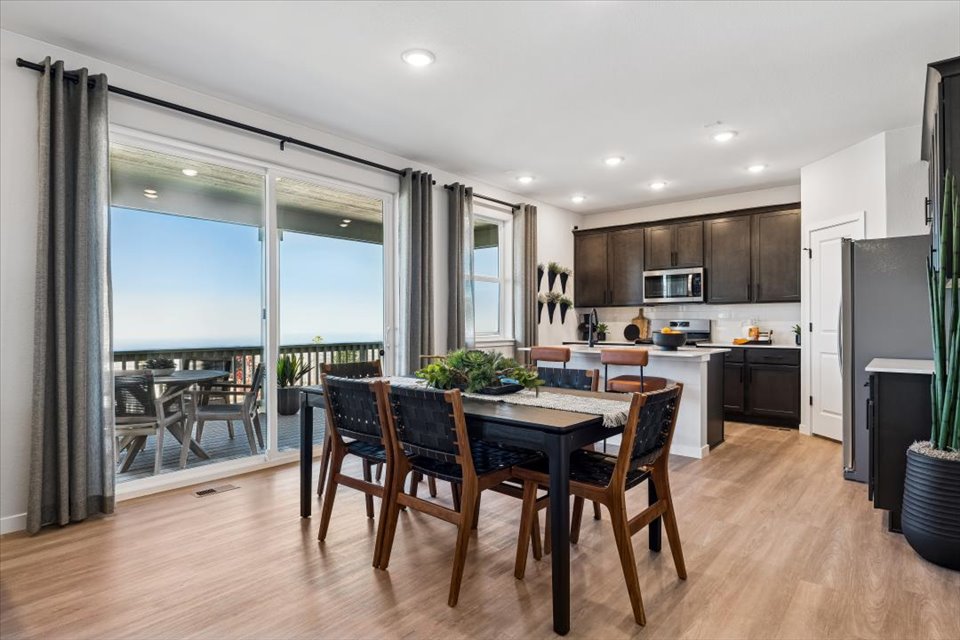 A kitchen with a dining table.