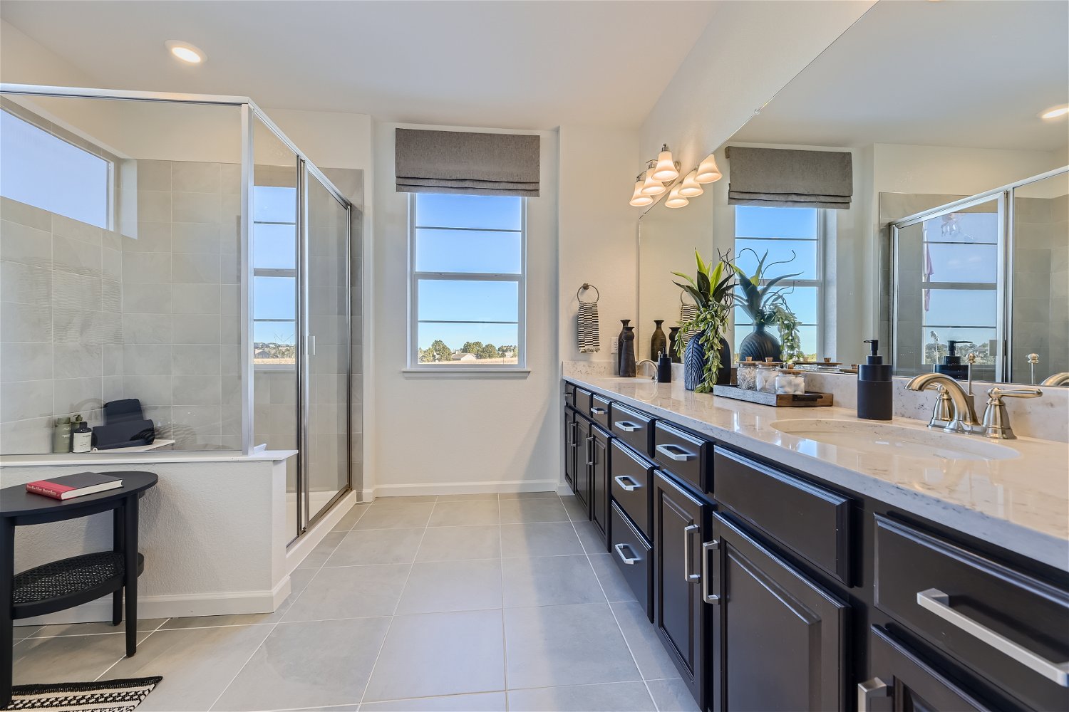 A bathroom with a large glass shower.