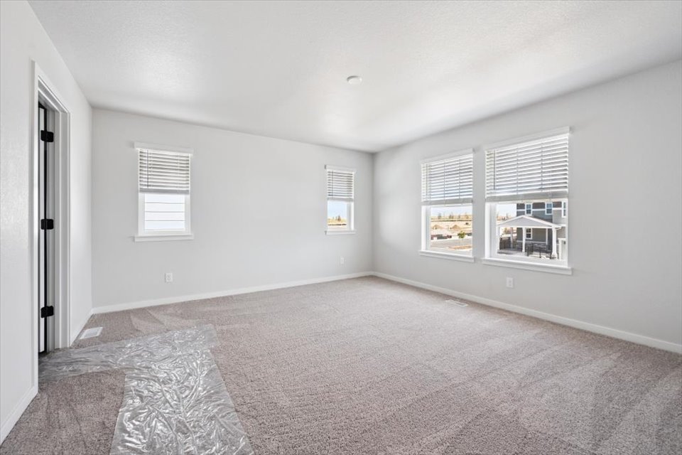 A room with a rug and a rug.