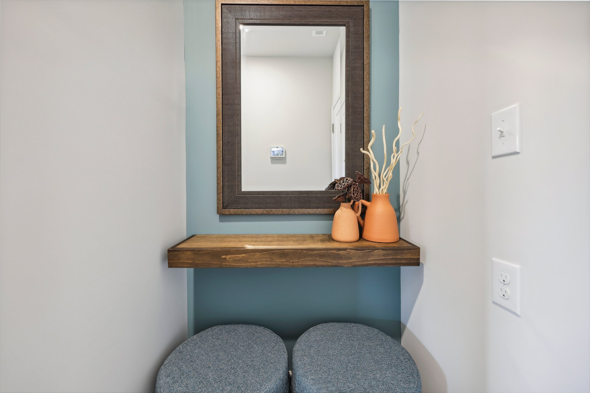 A mirror on a wall.