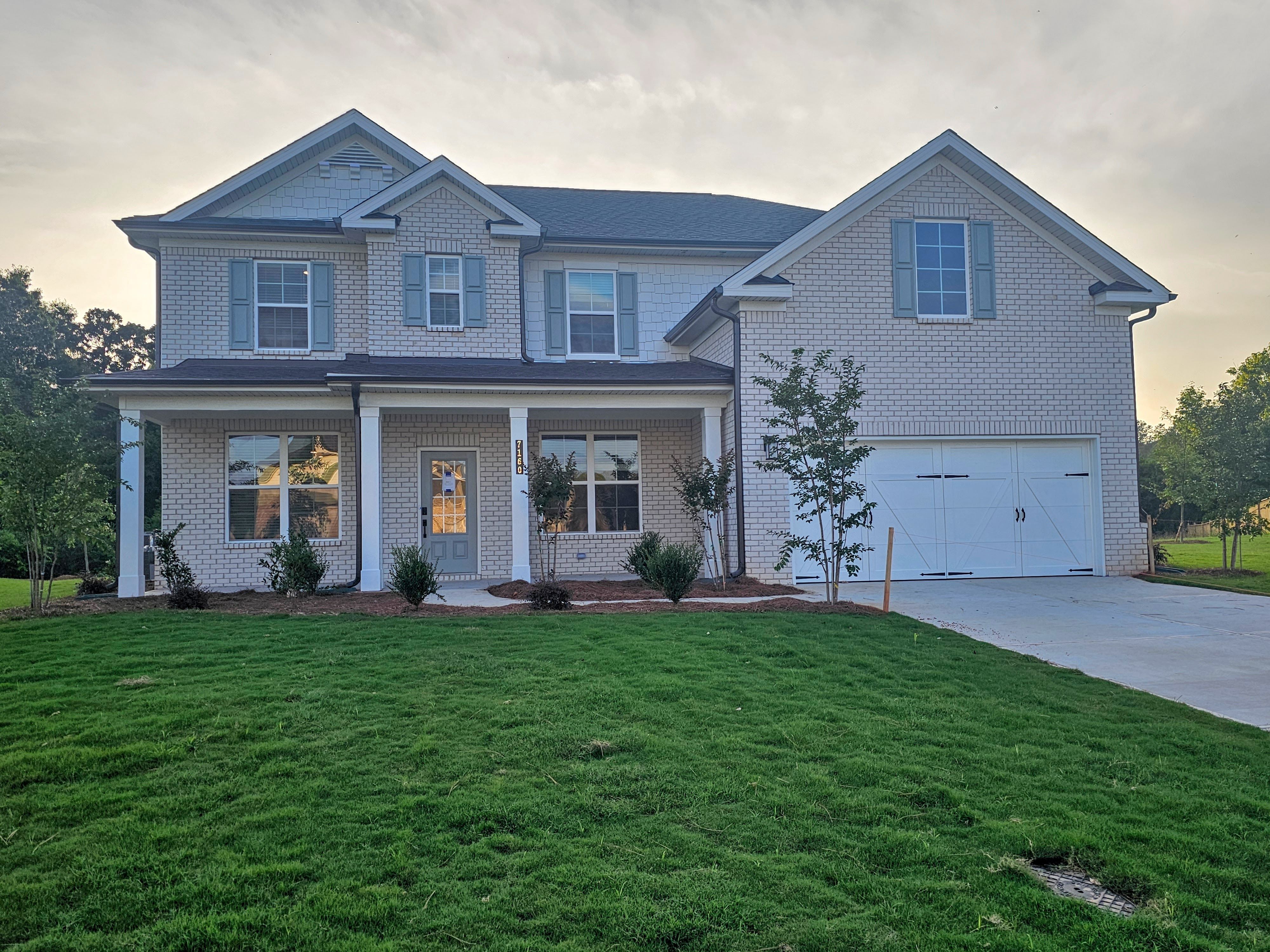 A house with a large front yard.