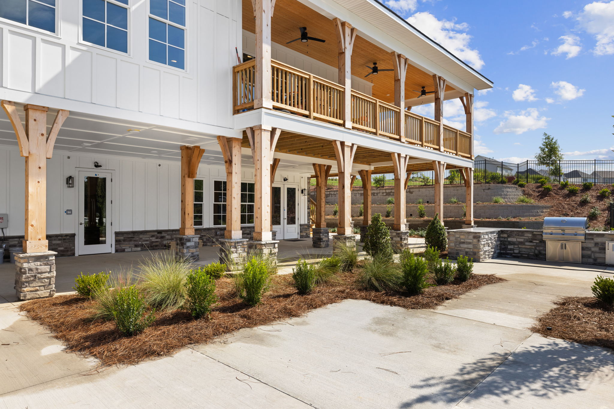 A white building with a walkway.