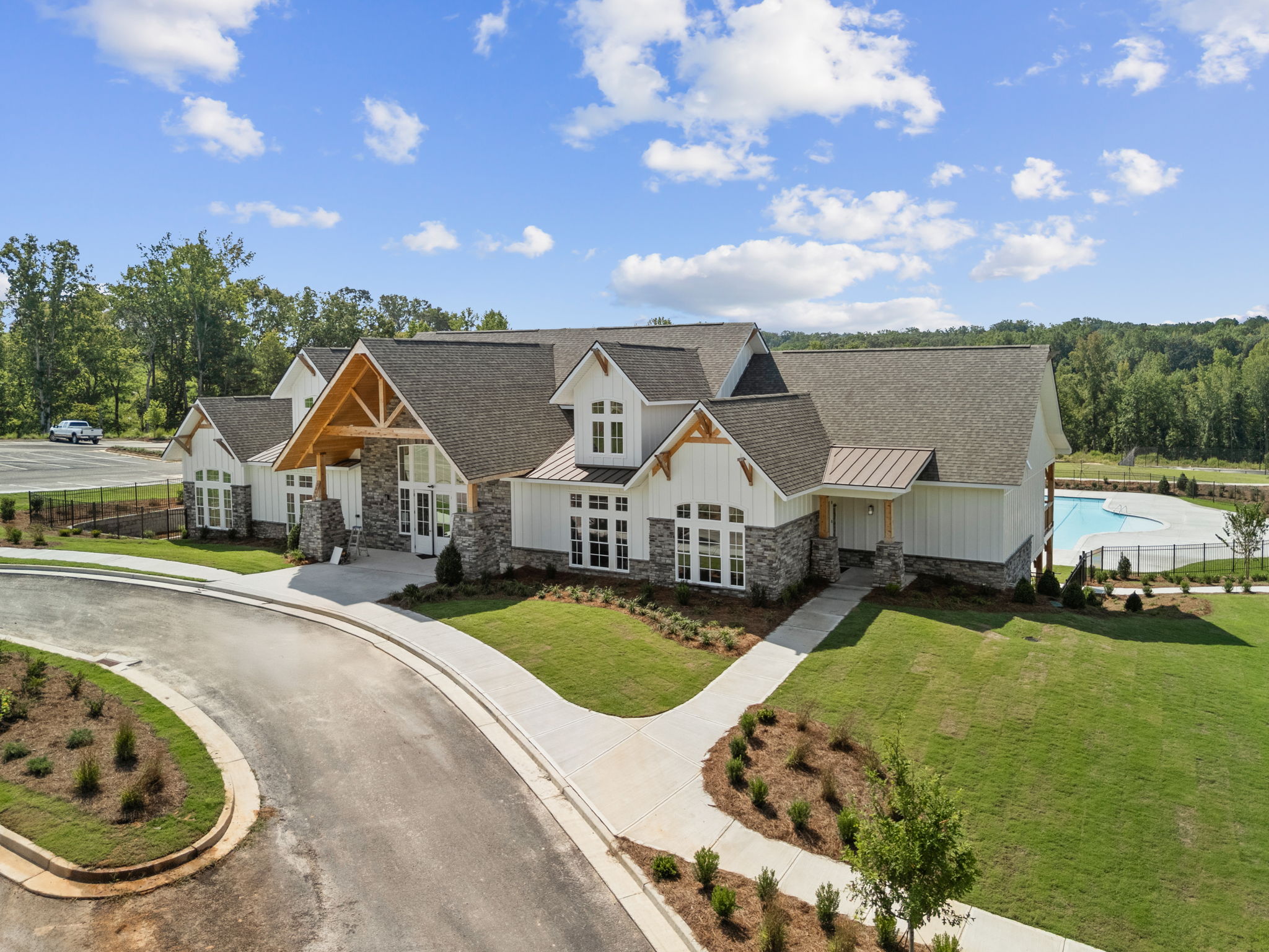 A road leading to a large house.