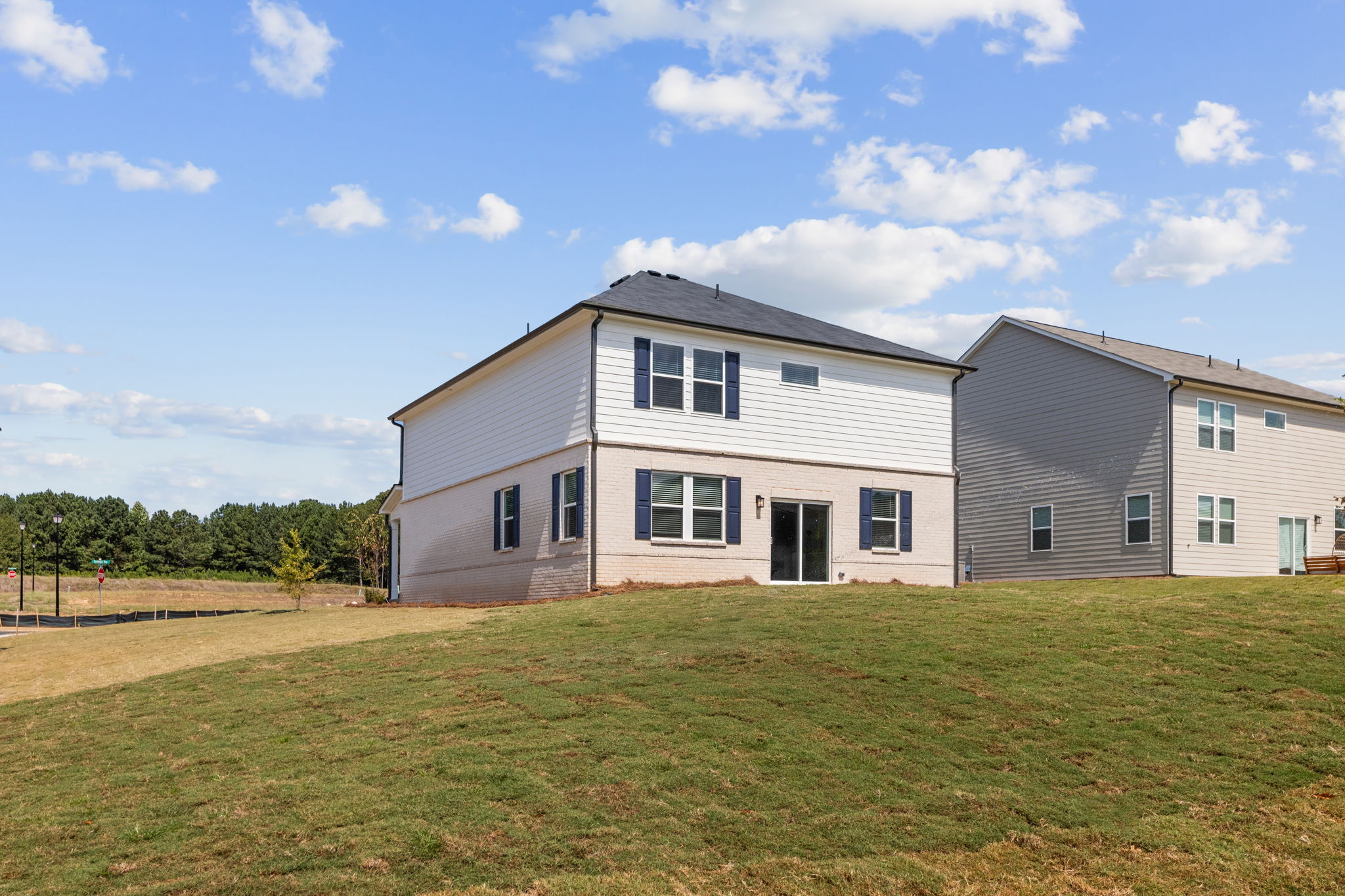 A large house with a lawn in front of it.