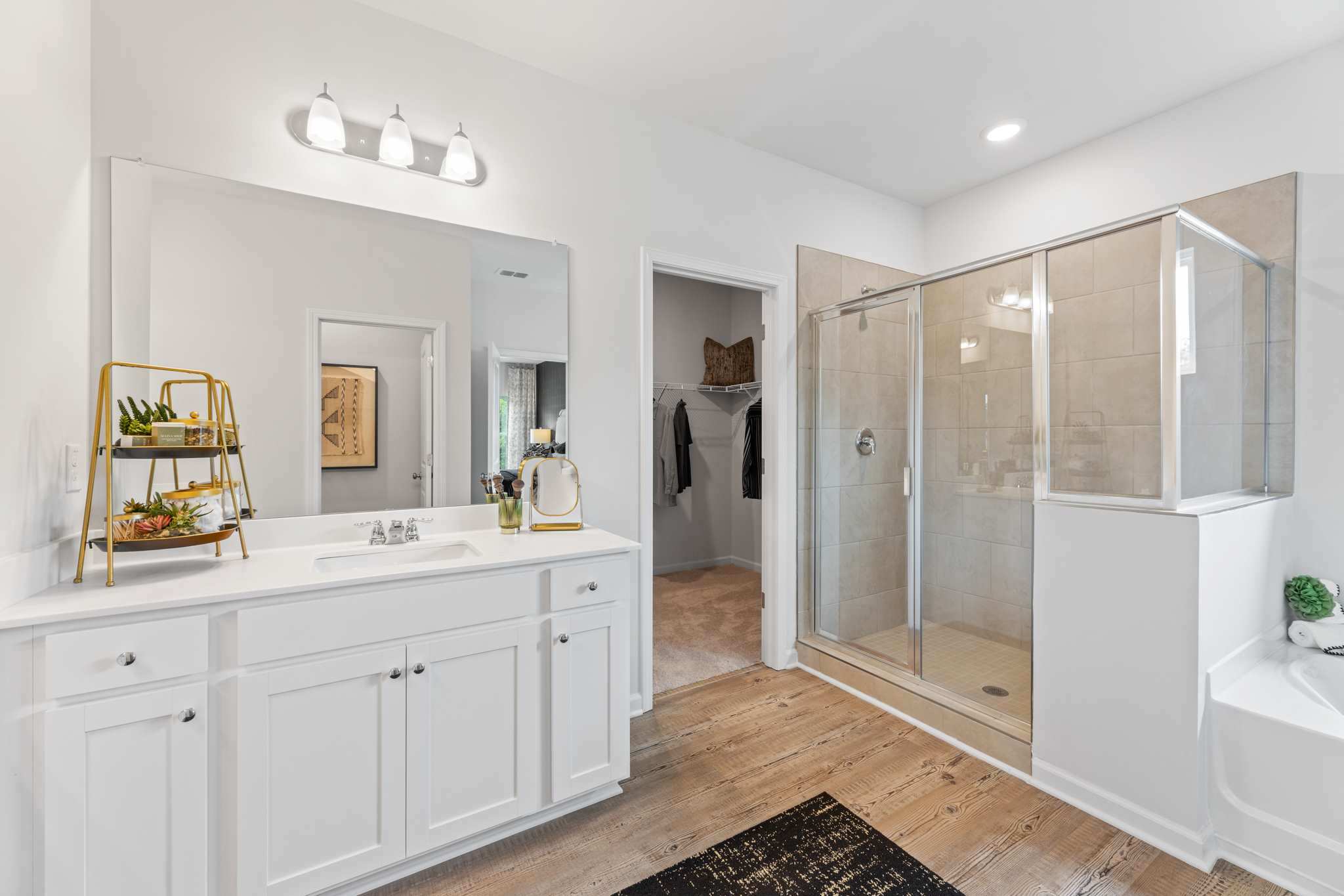 A bathroom with a glass shower.