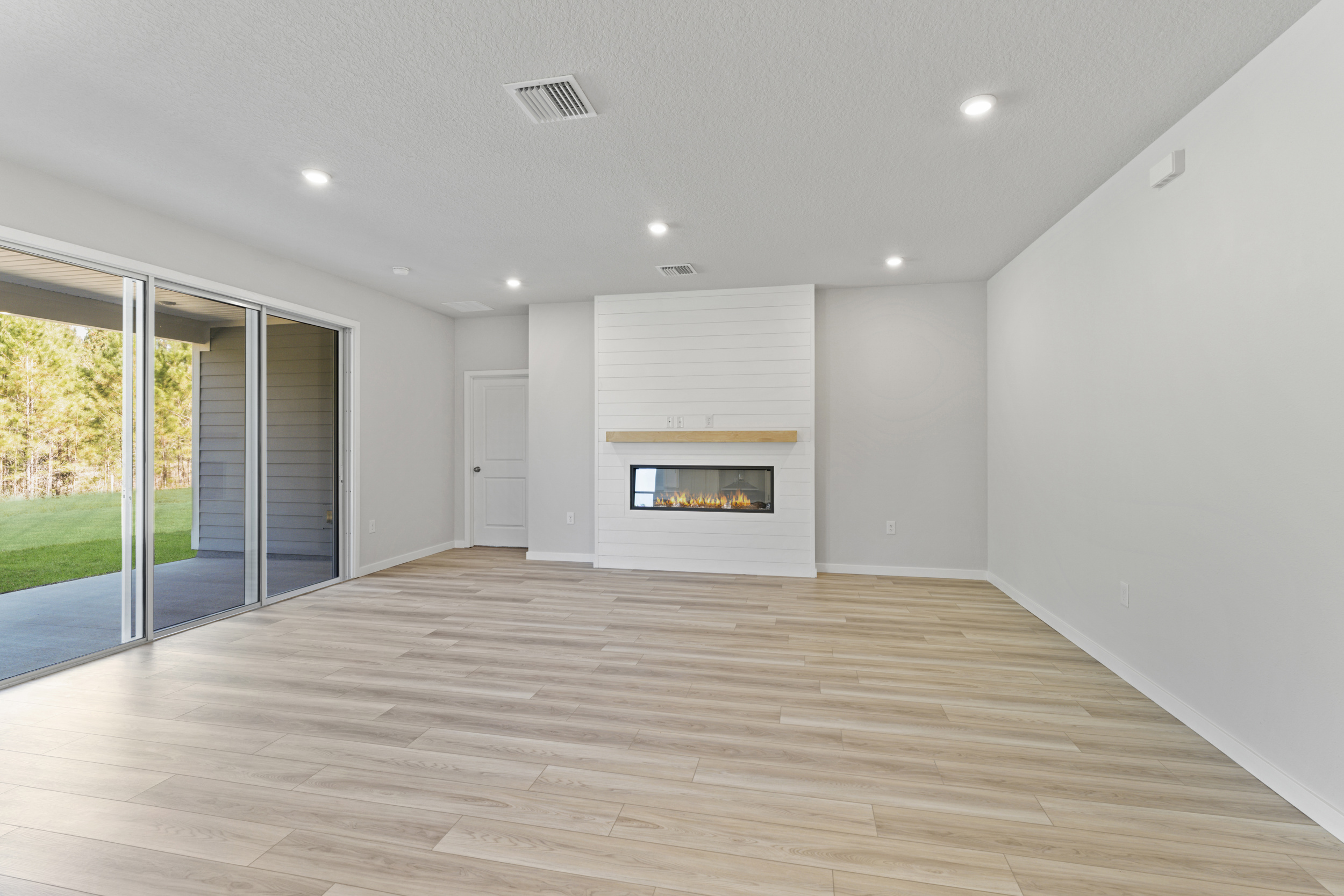 Lot 531 Living Room with Electric Fireplace at NorthShore in Kingsland