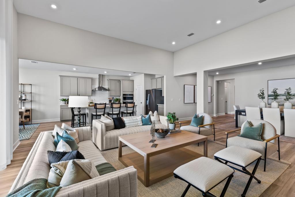 A living room with a large glass wall.