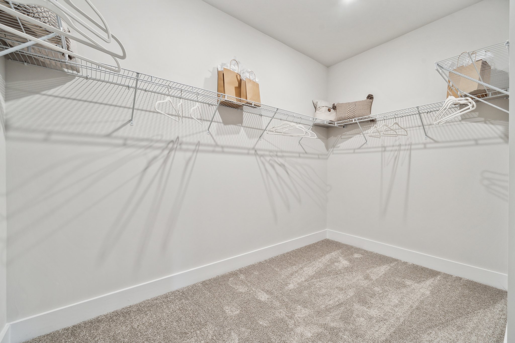 A white staircase with a white railing.