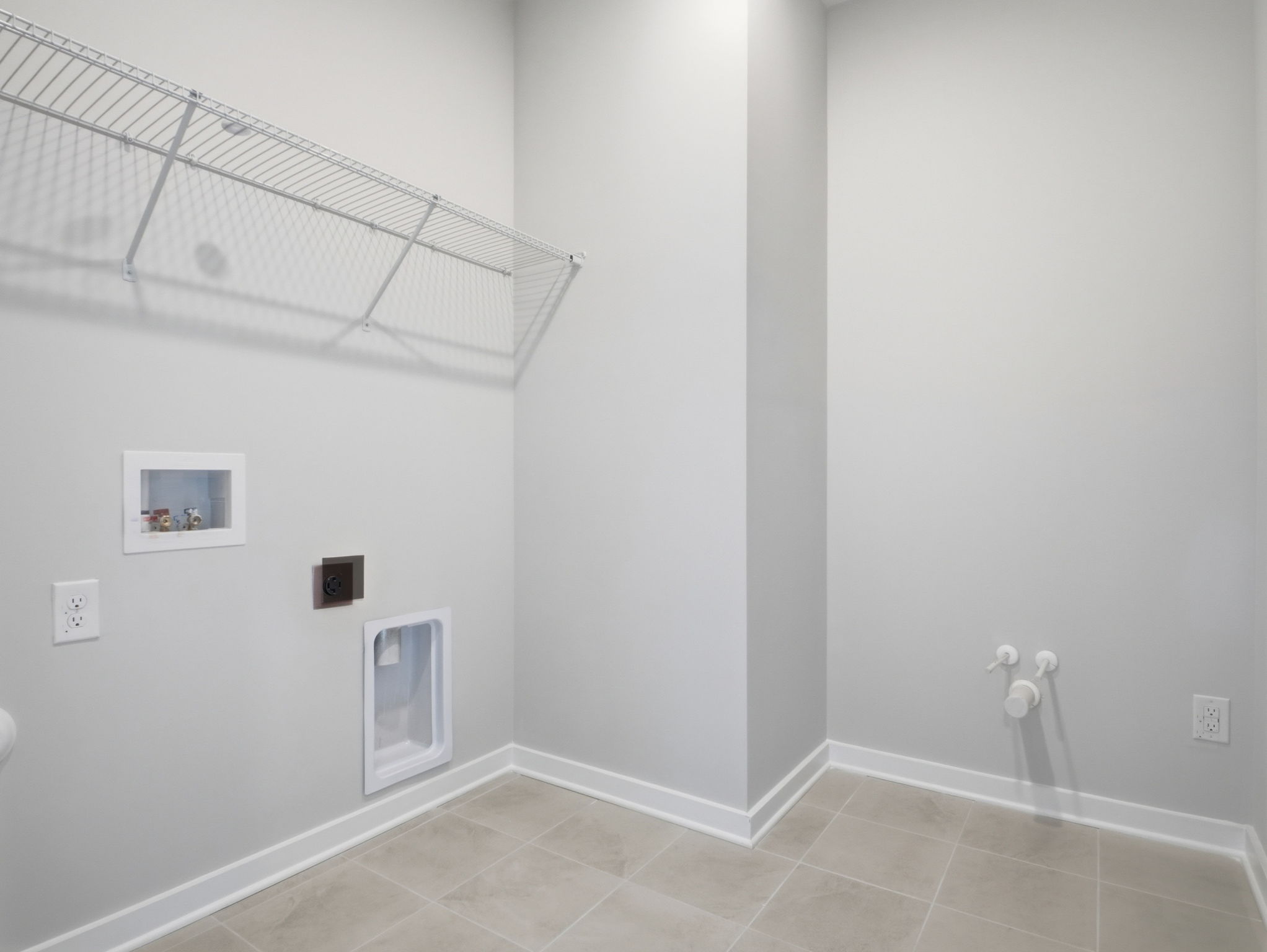 A bathroom with a shower unit.