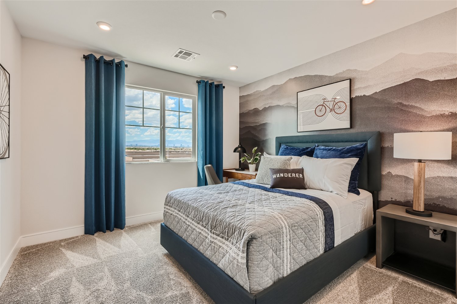 A bedroom with a bed and a window.