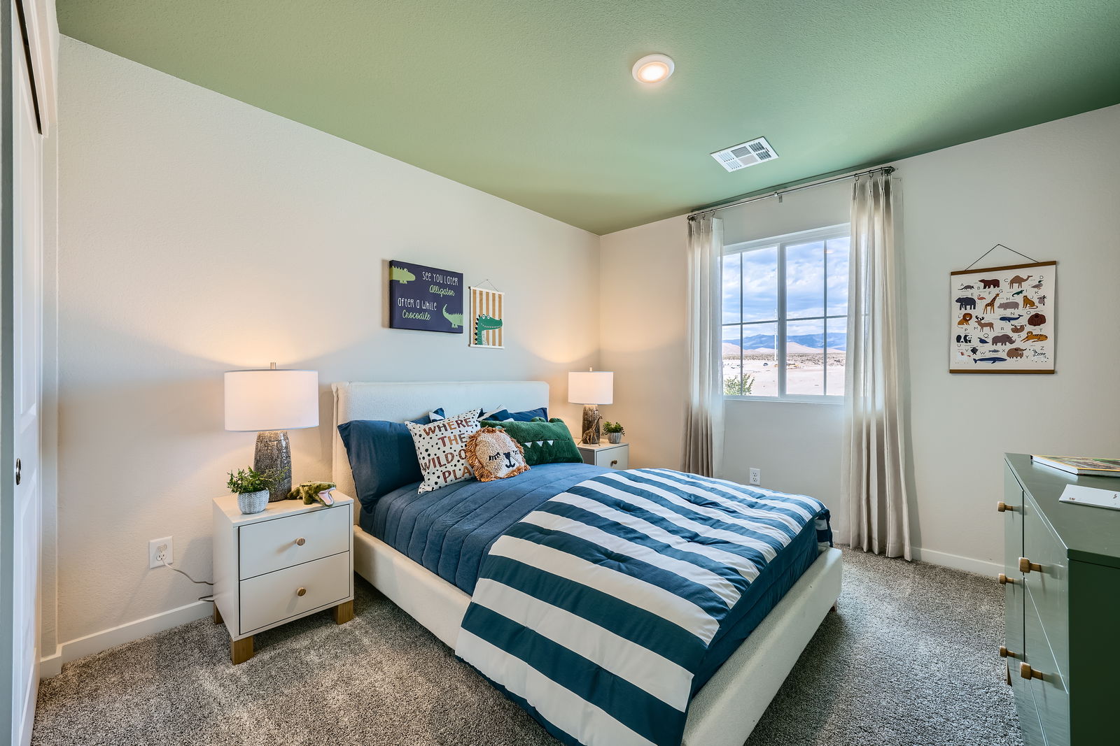 A bedroom with a bed and a window.