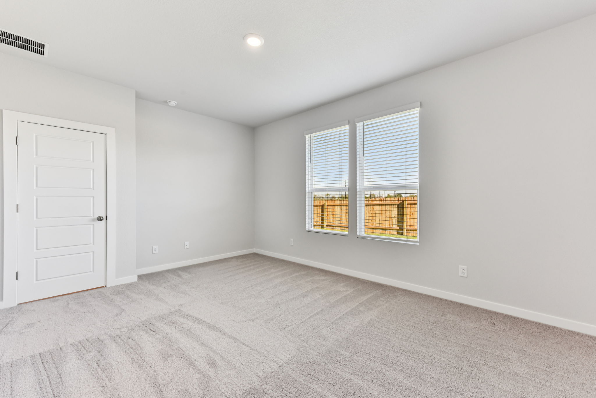 A room with a door and a window.