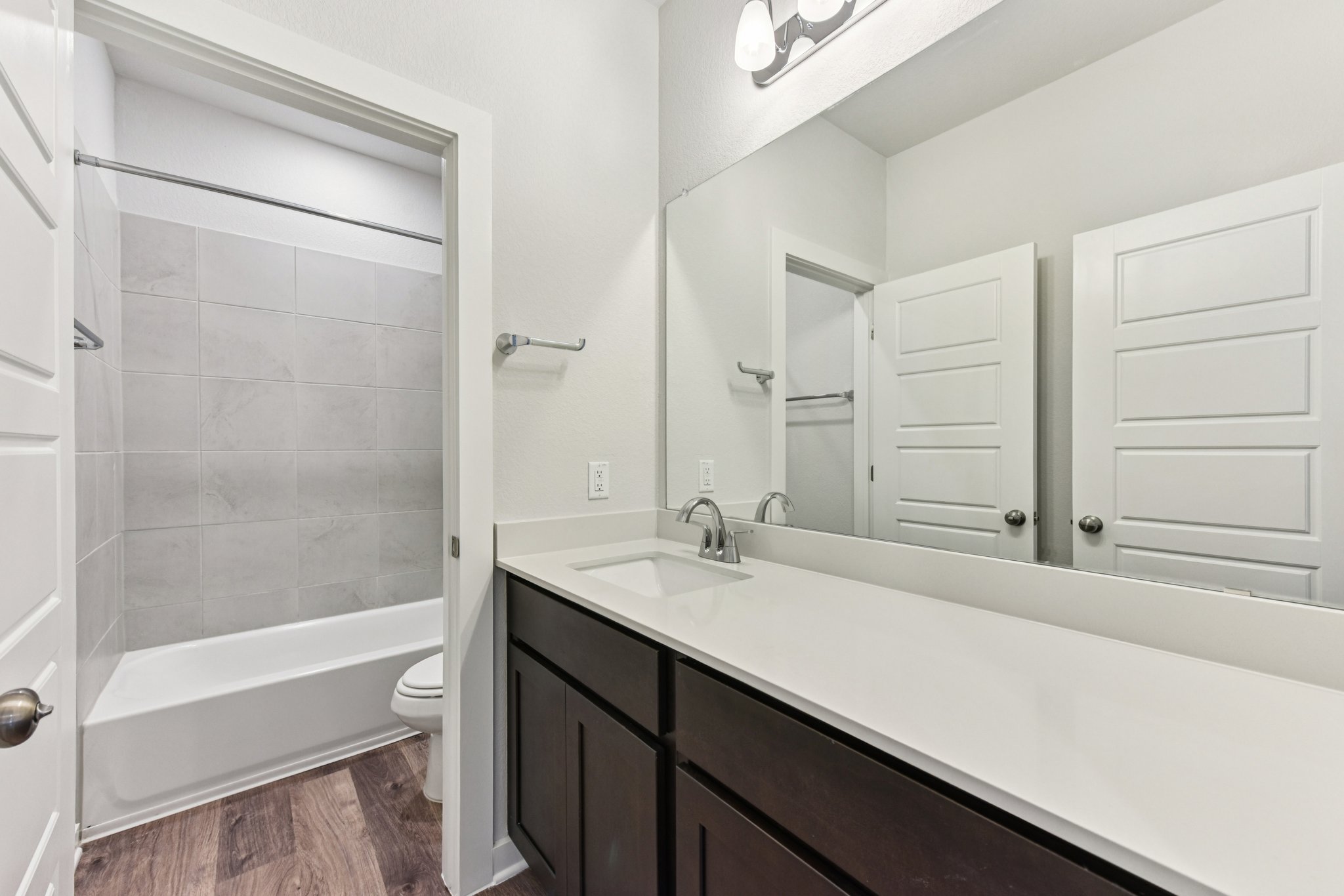 A bathroom with a tub and sink.