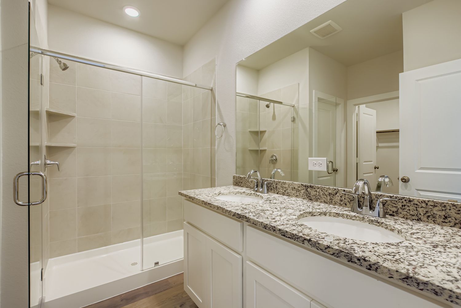 A bathroom with a marble countertop.