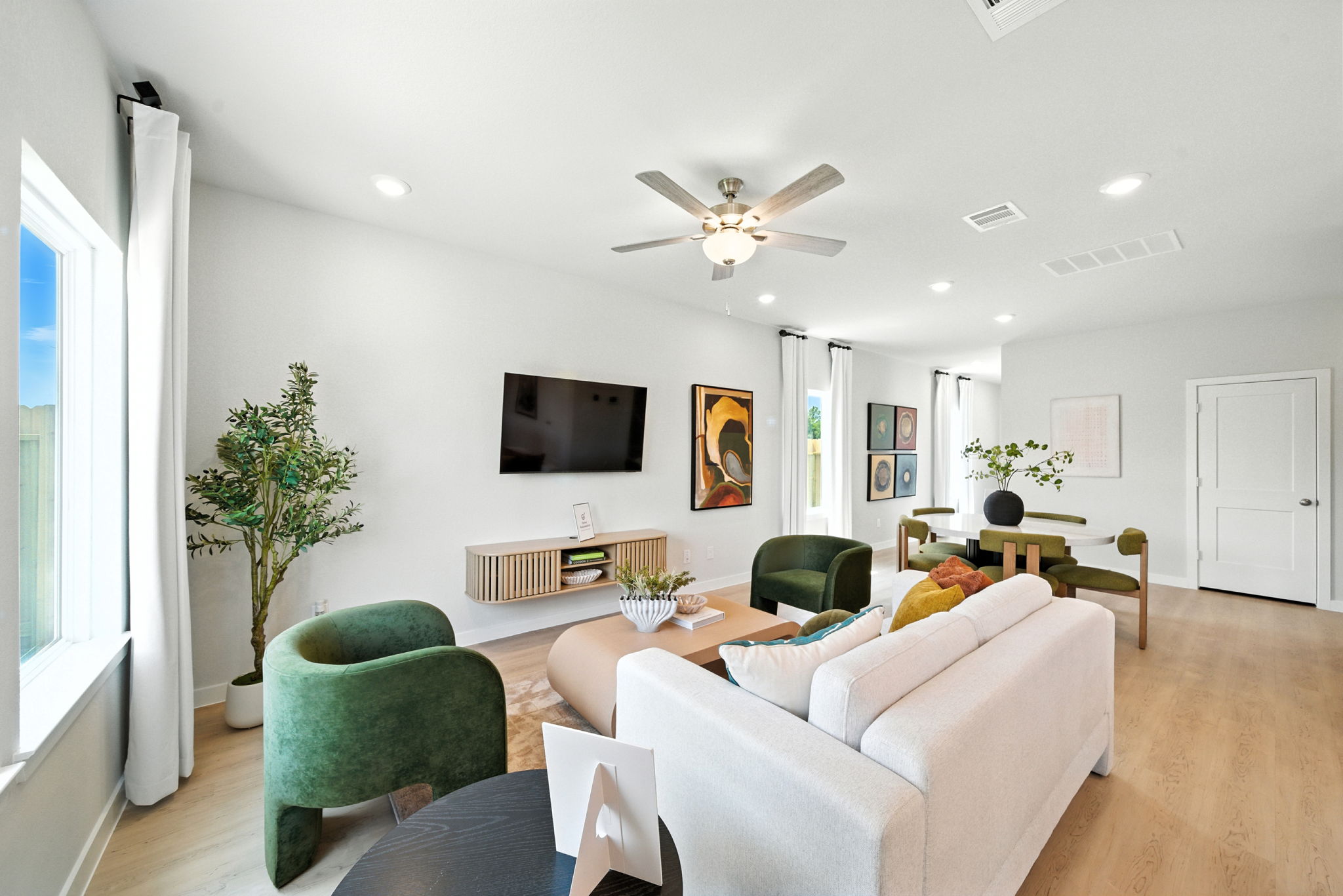 A living room with a tv and couches.